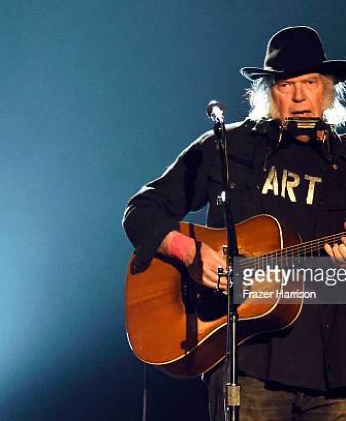 LOS ANGELES, CA - FEBRUARY 06:  Singer Neil Young performs onstage at the 25th anniversary MusiCares 2015 Person Of The Year Gala honoring Bob Dylan at the Los Angeles Convention Center on February 6, 2015 in Los Angeles, California. The annual benefit raises critical funds for MusiCares' Emergency Financial Assistance and Addiction Recovery programs.  (Photo by Frazer Harrison/Getty Images)